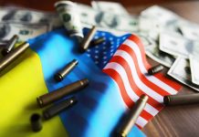 Flags bullet casings and dollar bills on table