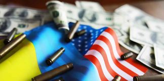 Flags bullet casings and dollar bills on table