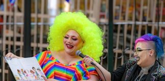 Person reading childrens book with bright colorful outfit