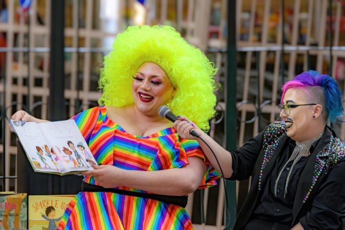 2164843967 featured image Person reading childrens book with bright colorful outfit