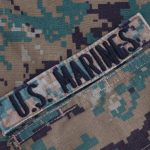 US Marines patch on camouflage uniform fabric