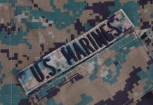 US Marines patch on camouflage uniform fabric