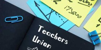 Notebook labeled "Teachers Union" with office supplies.