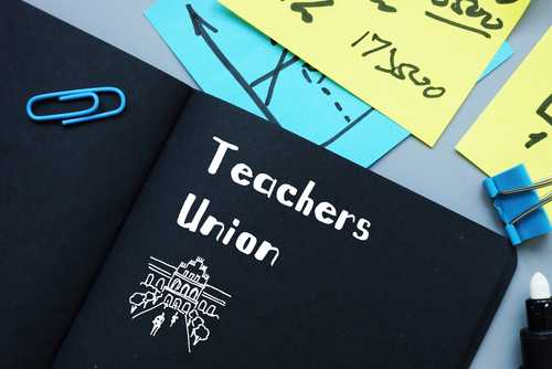 shutterstock_1746940400.jpg featured image Notebook labeled "Teachers Union" with office supplies.
