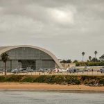 Aircraft hangar with helicopters near the beach