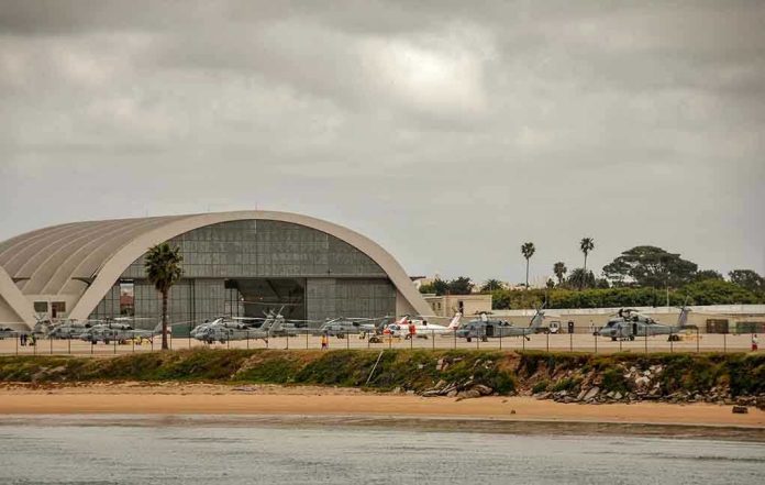 1086141389 Aircraft hangar with helicopters near the beach