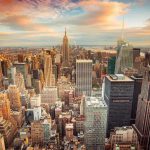 New York City skyline at sunset with tall buildings
