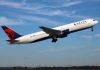 Delta airplane taking off from runway