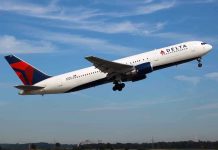 Delta airplane taking off from runway