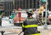 FDNY firefighter at scene with fire truck present