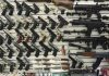 Wall display with handguns and rifles for sale