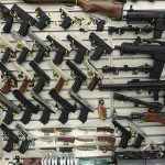 Wall display with handguns and rifles for sale