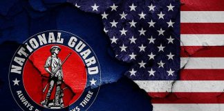 National Guard logo over a distressed American flag.