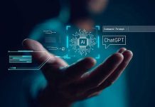 Hand holding digital AI and ChatGPT graphics