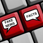 Keyboard keys labeled Fake News and Facts.