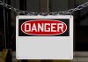 A warning sign displaying the word 'DANGER' in bold red letters