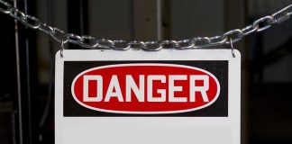 A warning sign displaying the word 'DANGER' in bold red letters