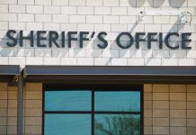 Sheriffs Office sign on brick building faade.