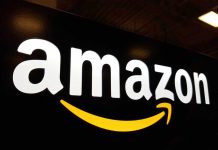 Amazon SLASHES 14,000 Jobs — AI Takeover Begins Amazon logo with a yellow smile arrow.