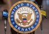 Senator Under SIEGE From Own Party – They Want Him Out! Sign displaying United States Senate in a government building