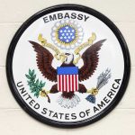 US Embassy PANIC—Americans Ordered to Hide Seal of the United States Embassy featuring an eagle and the American flag
