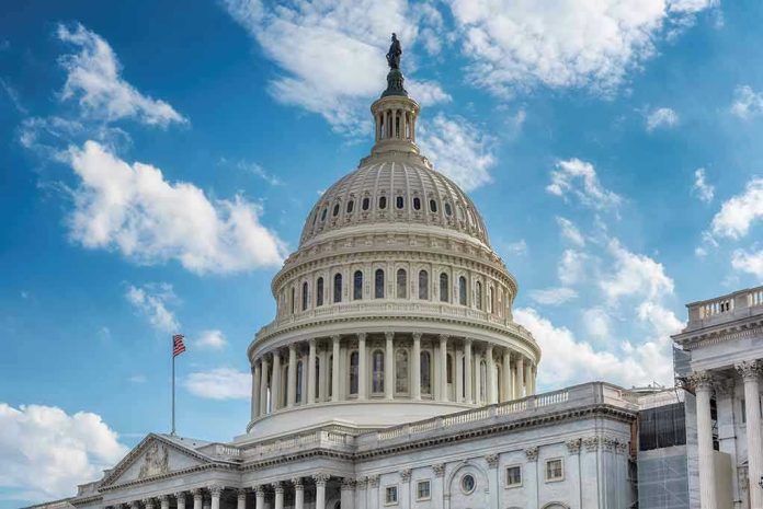 U.S. Capitol building dome under clear blue sky.