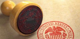Federal Reserve stamp and wooden stamp on paper