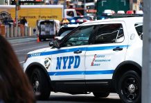 Mamdani Appoints Anti-Police Radical for TOP Position NYPD police car on a city street scene.