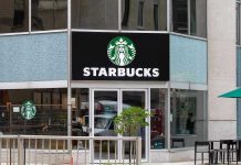 Nationwide Strike CRIPPLES Starbucks – Corporate Assault! Starbucks storefront with glass doors and logo