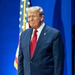 Trump BLINDSIDE Congress – Stunned by 28 Demands Man in suit next to American flag.