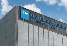 FDA building with blue logo and sky background.
