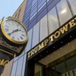 Clock in front of Trump Tower building entrance.