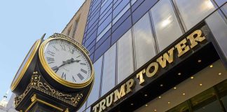 Clock in front of Trump Tower building entrance.