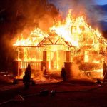 Fishing Town OBLITERATED – 170 Homes Gone Within Hours! House engulfed in flames with firefighters present.