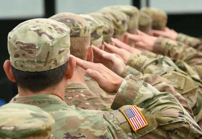 716351914 Soldiers in uniform saluting, American flag patch visible.