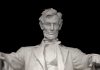 Marble statue of Abraham Lincoln seated with a serious expression