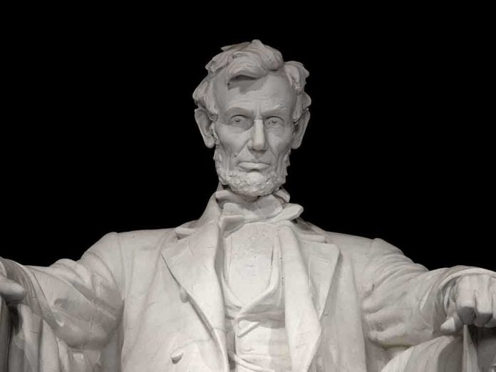 shutterstock_106726592.jpg Marble statue of Abraham Lincoln seated with a serious expression