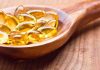 Healthy Hack or MONEY DRAINING HYPE? Golden omega 3 capsules in a wooden spoon