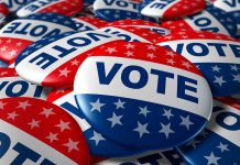 Campaign TURMOIL – Dark Past Rocks Candidates Hopes A pile of colorful buttons with the word VOTE and stars, symbolizing election participation