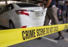 BRUTAL Assault Rocks Hospital Parking Garage Crime scene tape blocking off white sedan.