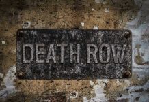 DEATH ROW Execution HALTED By Scandal Weathered Death Row sign on aged concrete wall