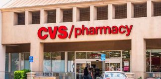 Exterior view of a CVS pharmacy with customers entering