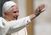 Pope Benedict XVI smiling and waving during a public appearance