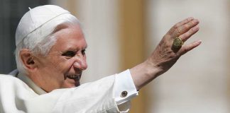 Pope Benedict XVI smiling and waving during a public appearance