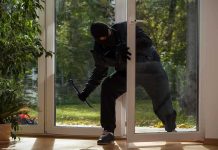 NFL Star’s Home Hit in BRAZEN Break-In A burglar in dark clothing entering a house through a glass door