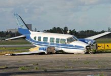 Plane vs Car: Unbelievable I-95 Collision Damaged blue and white small airplane on an airport runway