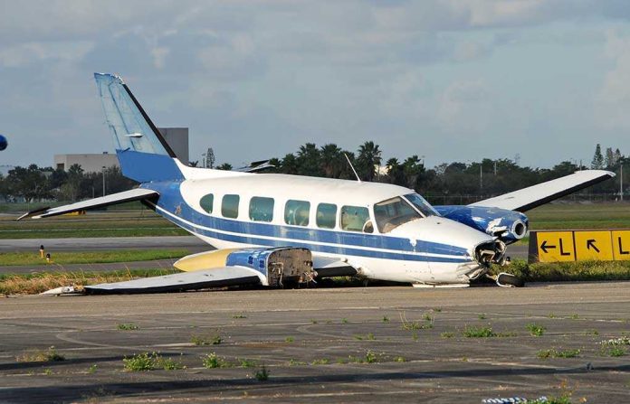 shutterstock_2445734.jpg Damaged blue and white small airplane on an airport runway