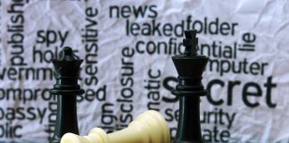 Chess pieces with secretive background text pattern