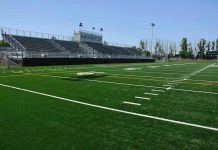 Military Ceremony Goes COMPLETELY Sideways Empty football field with bleachers in background.
