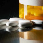 Deadly Fentanyl LIE Fooling Millions Daily White pills beside an orange pill bottle.